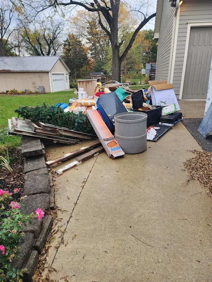 Dumpster being loaded with debris for 3 Yard Dumpster Rental in Whitmore Village